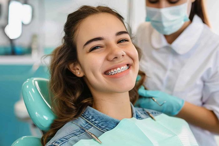 Orthodontics Erie - A girl with braces in a dental clinic smiling